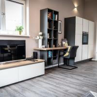 Ferienwohnung Küche Kochen Einrichtung Schrank Sofa Wohnen Esstisch Stühle Mediaboard Küchenmöbel Holzoptik Siemens Bora